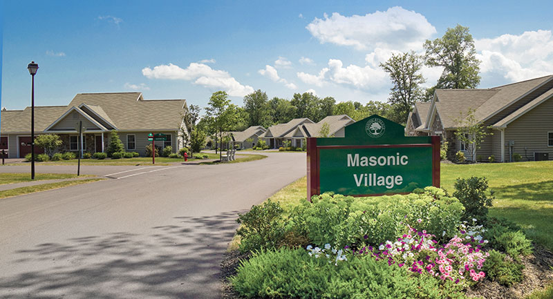 Residential street with sign in Masonic Village at Sewickley