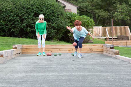 Women playing bocce together